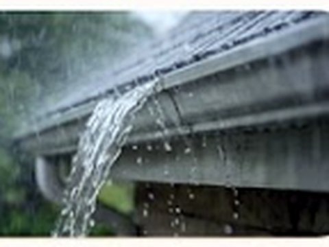 Overflowing water from a blocked gutter